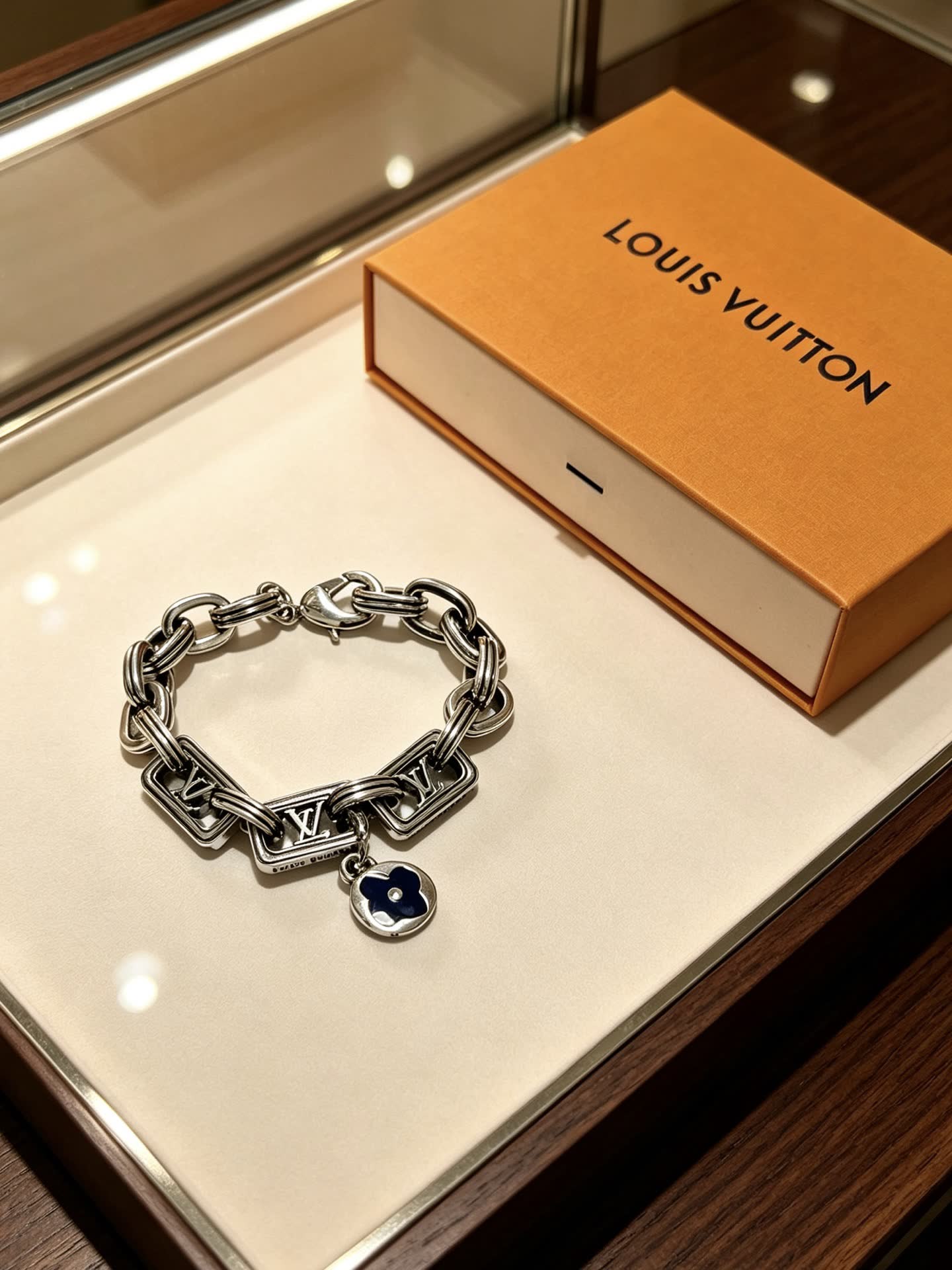 Louis Vuitton Silver Tone Bracelet with Monogram Charm